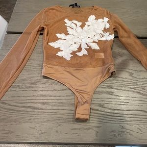 Mesh embroidered body suit.